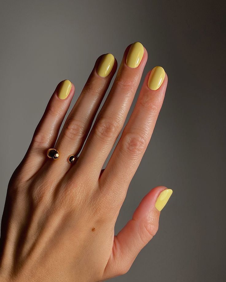 at-manucurist-polishes-at-sezane-jewellery-the-shade-is-mimosa-by-at-manucurist-my-ring-is-ama-in-yellow-gold-by-at-sezane.jpeg