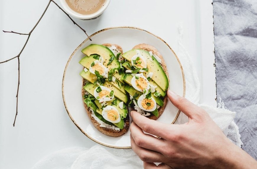 stocksy-avocado-toast-eggs-tatjana-zlatkovic.jpg