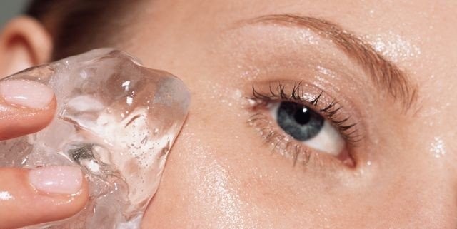 woman-putting-ice-on-her-face-royalty-free-image-1624905175.jpg